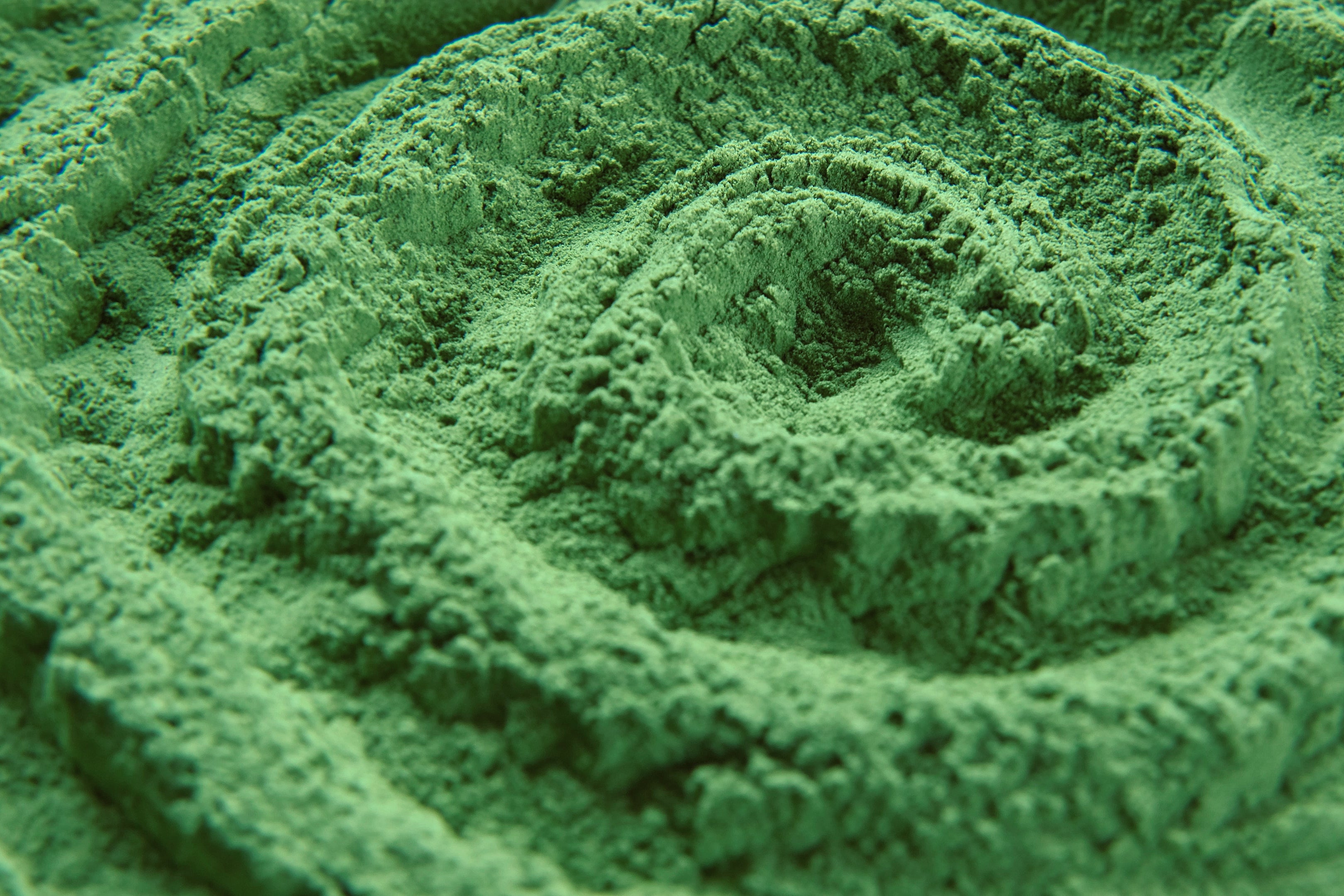 Premium green supplement powder close-up